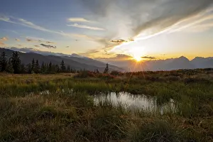 Autumnal mountain landscape with small pond
