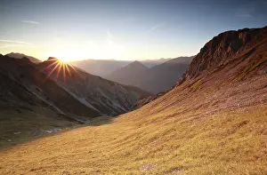 Autunm sunrise over mountains in Alps