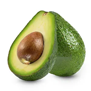 Two avocados, whole and half, isolated on white background