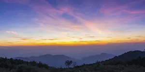 Awestruck by Twilight: Mountains Below Sunset Sky