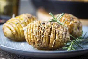Baked hasselback potatoes with cheese