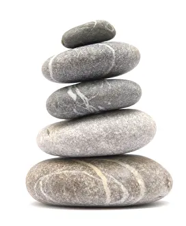 Balancing stone tower isolated on white background