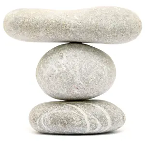Balancing stone tower isolated on white background