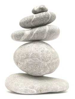 Balancing stone tower isolated on white background