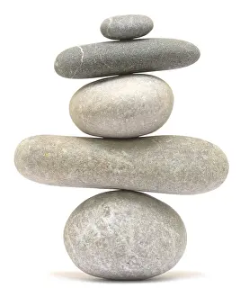 Balancing stone tower isolated on white background
