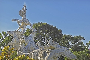 Balinese stone mythology figures on horse statues, Denpasar, Bali, Indonesia, Asia