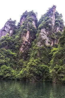 Baofeng lake scenery with lush forest surrounding the tall stone peaks
