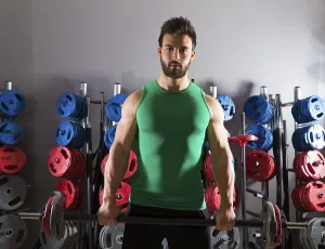 Barbell beard man workout fitness at weightlifting gym