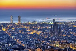 The Barcelona skyline with the famous Sagrada Familia in front of sunrise