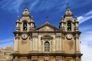 Baroque facade with clocks for time and date