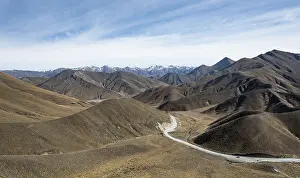 Barren mountain landscape with pass road