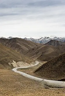 Barren mountain landscape with pass road