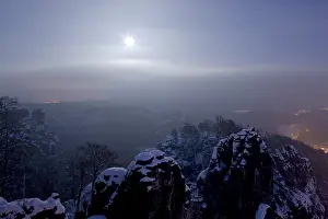Bastei rock at full moon in winter