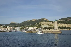 Bay with lighthouse and rocks, Mediterranean coast