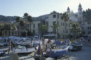 Beach with boats and town, Laigueglia