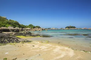 Beach with rocks and sand at the Plage Saint Guirec