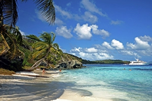 Beach on the Tobago Keys, dream beach, crystal clear water, anchoring luxury yacht, holidaymakers having fun in the water, Grenadines, Caribbean