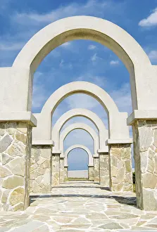 Beautiful architecture, winding corridor with arch door decoration in the park