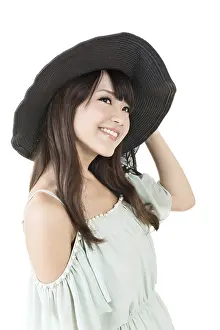 Beautiful elegant asian young woman with black hat