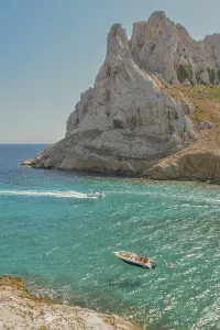A beautiful island with a rocky coastline and a blue sea