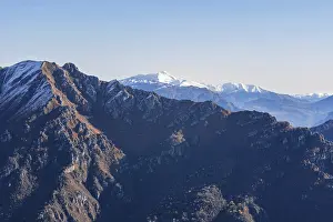 Beautiful landscape of the layered misty hazy Italian Alps mountain range during evening