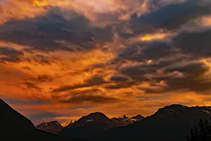 Beautiful Mountain View with Snow and Cloudscape in Sunset over the Swiss Alps in a Summer Night in Samedan