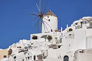 Beautiful panorama view from the old castle of Oia village with traditional white houses