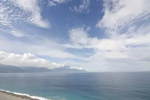 Beautiful seascape with shoreline and mountain in the distance