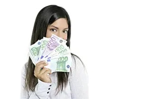 Beautiful sucess businesswoman holding Euro notes isolated on white