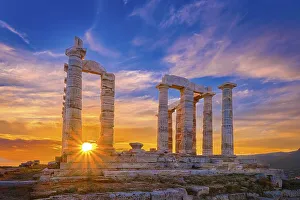 Beautiful sunset sky and ancient ruins of temple of Poseidon