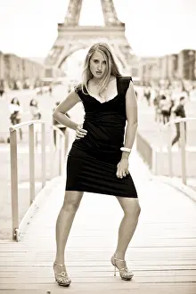 Beautiful woman with Eiffel Tower on the background