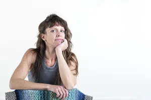 Beautiful woman looking at camera over a white background