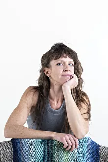 Beautiful woman looking at camera over a white background