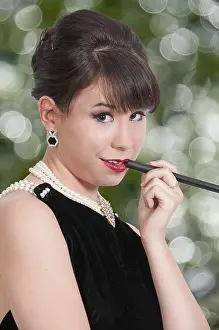 Beautiful young attractive woman movie star modeling a pose