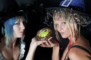 Beautiful young witches with a sand boa constrictor snake