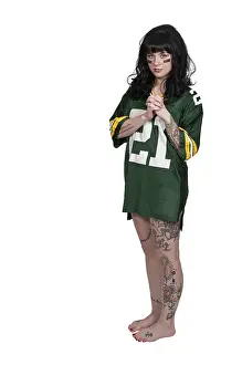 Beautiful young woman playing a game of football