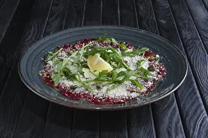 Beef carpaccio with grated cheese