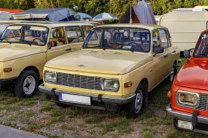 Beige square vintage car with headlights