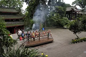 Believers give votive candles, Wannian monastery