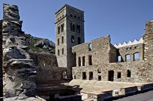 Bell tower from the south-east with ruined buildings