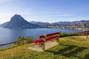 Bench with Mountain View over Alpine Lake Lugano and Cityscape in a Sunny Day in Lugano