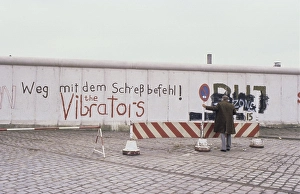 The Berlin Wall. A guarded concrete barrier that encircled West Berlin from 1961 to 1989