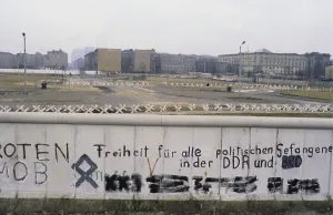 The Berlin Wall. A guarded concrete barrier that encircled West Berlin from 1961 to 1989