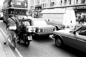 Bicycle bike car tempo and bus on London street England United Kingdom UK 1986