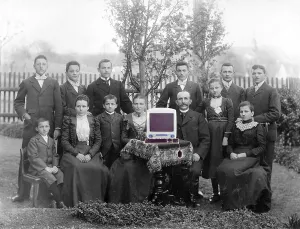 Big family, group shot with one of the first Macs
