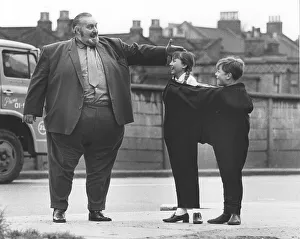 Big man with children, England, Great Britain