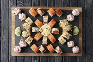 Big set of rolls served on stone plate