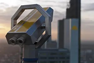 Binoculars in front of Frankfurt's skyline with the Commerzbank building