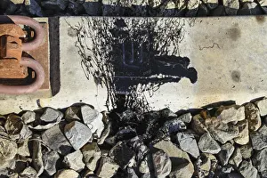 Black resin shed on the railroad ties