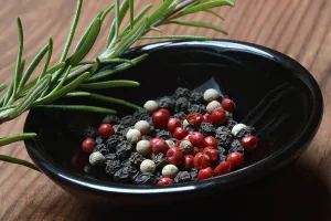 Black and white peppercorns in shell